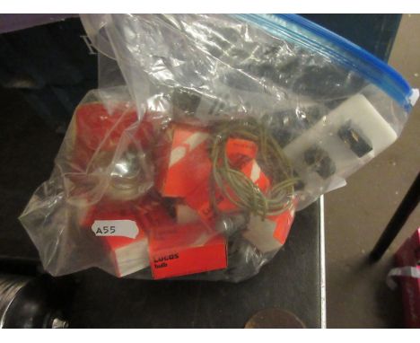 Bag containing various Lucas bulbs, electric switches etc