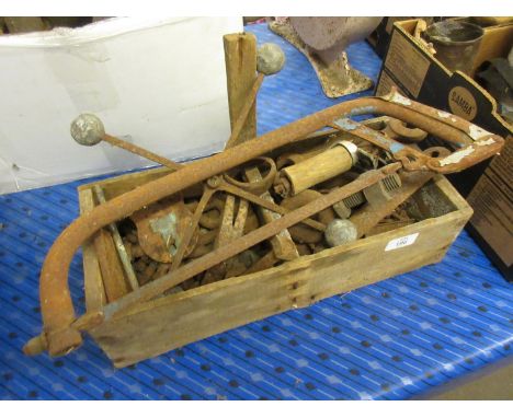 Wooden tool tray containing assorted metal tools, possibly binder-related