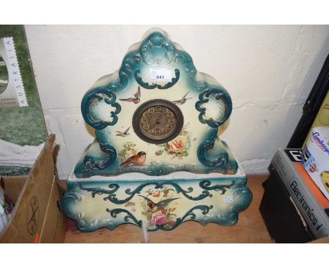 EARLY 20TH CENTURY CERAMIC CASED CLOCK AND STAND