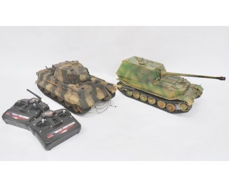 Two Torro Radio Controlled German Tanks. These large scale metal radio controlled tank are accompanied by a radio control uni