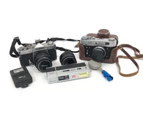 Vintage Camera Equipment. Including “Fed 3” Camera and case. ... Konica Autoreflex T3. ... Halina Telewide. ... Plus extra le