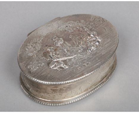 A Victorian silver table snuff box of ovoid form possibly by Isidor Weil. With repousse decoration in Dutch style depicting p