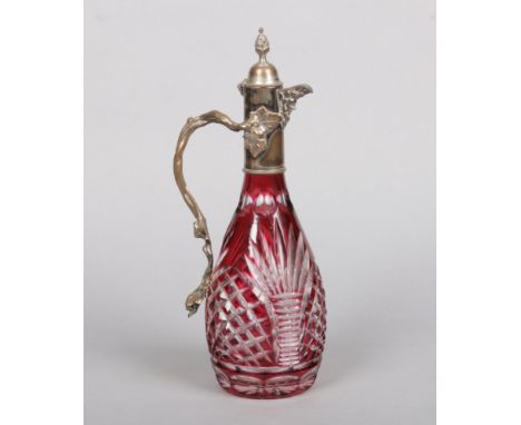 An early 20th century cut and ruby flash claret jug with silver plated mounts, 34cm.