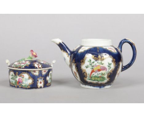 A Worcester butter tub and cover with flower moulded knop and a globular teapot. Both scale blue ground, with gilt cartouches