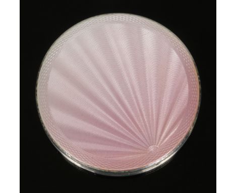 An Art Deco circular silver and pink guilloche enamel powder compact by Henry Clifford Davis. Assayed Birmingham 1951, 6.75cm
