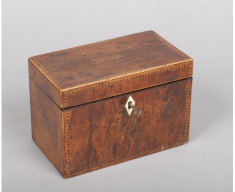 A Regency yew wood tea caddy. With chequered banding and bone escutcheon. Along with a Victorian silver caddy spoon assayed B