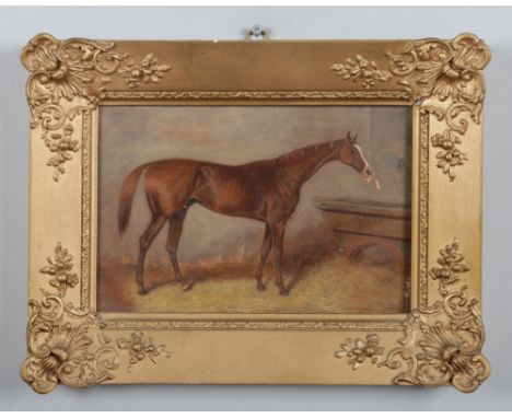 A 19th century gilt framed oil on board. Stable interior portrait of a rachorse. Inked label to the reverse, Blair Athol, win