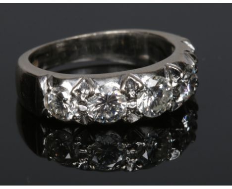 An 18 carat white gold five stone diamond ring. Set with five brilliant cut diamonds approximately 1.2ct total. Hallmarked Lo