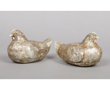 A pair of Chinese mother of pearl and ivory boxes formed as nesting hens. Each opening to reveal a further lidded section, 16