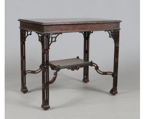 A Chinese Chippendale mahogany silver table. With blind fret carved frieze and raised on open fret carved square supports joi