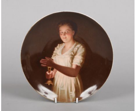 An early 20th century Vienna dish. Painted with the portrait of a girl holding a candle. Titled Good Night, underglaze blue s