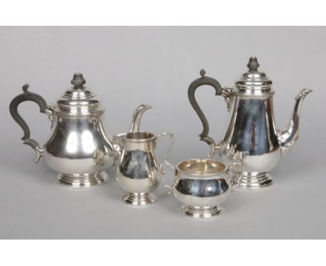 A silver four part tea and coffee service by Cooper Brothers&nbsp; Sons Ltd. Comprising a teapot, coffee pot, sugar bowl and 