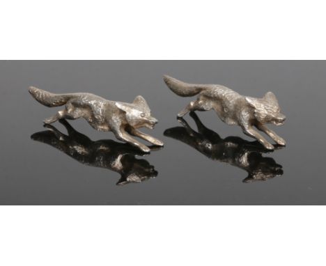 A pair of George V cast silver models of running foxes by William Hutton &amp; Sons Ltd. Assayed Sheffield 1925, 114 grams, 9