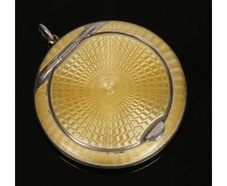 A George V silver powder compact by Horton &amp; Allday. Circular in form and with yellow guilloche enamel decoration. Assaye