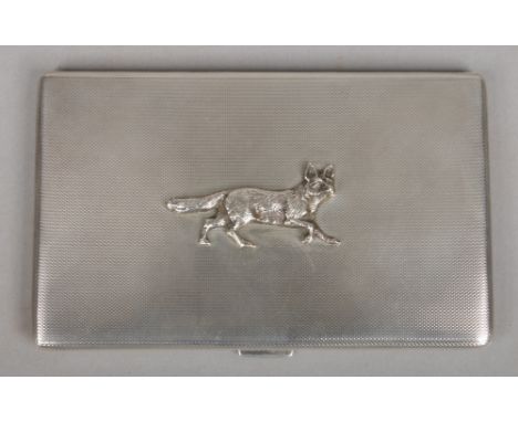 A George V silver cigarette case by Walker &amp; Hall. With engine turned engraving and surmounted with a cast model of a fox