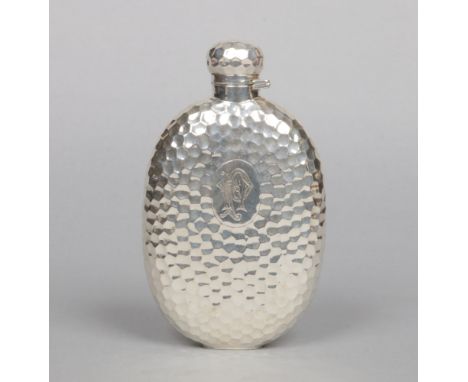 A Victorian hammered silver hip flask. Engraved with a P. W. monogram. Assayed Birmingham 1892, 236 grams, 16.75cm.Condition 