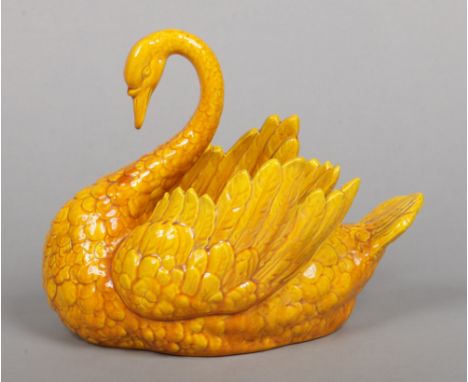 A Burmantofts Faience planter. Modelled in the form of a swan and glazed in yellow. Impressed mark, model 735, 19.5cm.&nbsp;P