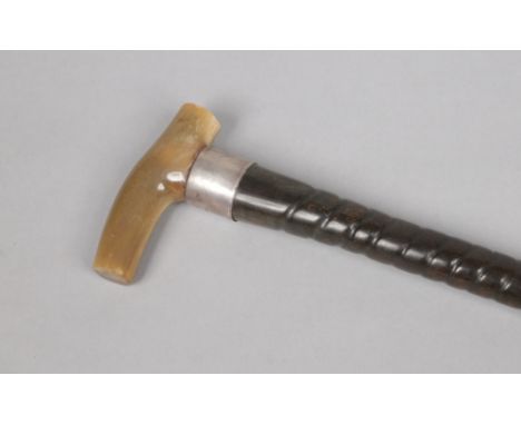 A Victorian impala horn walking stick with wide silver collar inscribed Jill and with horn handle. Assayed Sheffield 1897.