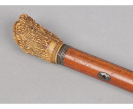 A Victorian malacca opera stick with antler grip.