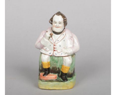 A 19th century Staffordshire figural tobacco jar and cover. Coloured in enamels and formed as a seated man with a pipe, 18cm.