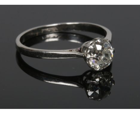 A platinum and old mine cut solitaire diamond ring. Diamond approximately 1.13ct, size R.Condition report intended as a guide