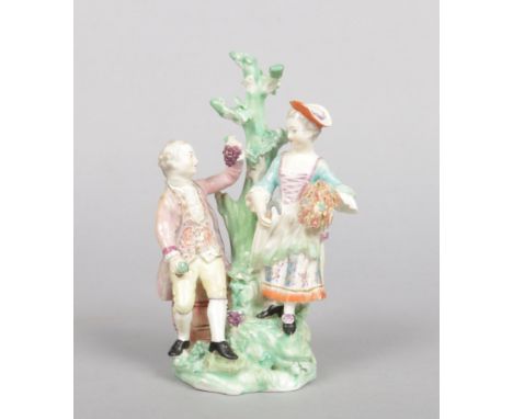A Derby allegorical figure group representing Autumn. Formed as a pair of figures harvesting grapes, patch marks c.1775, 20cm