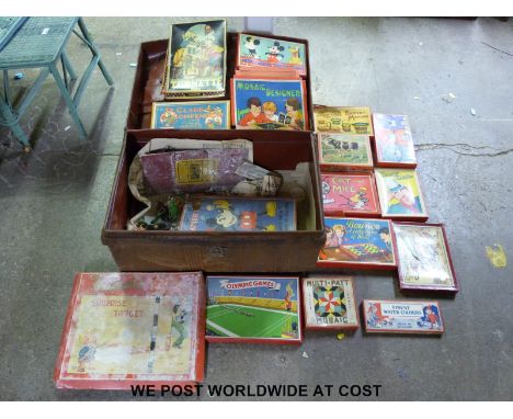 A vintage metal trunk full of toys and board games. 