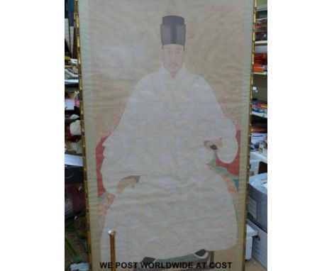 A large Chinese watercolour on silk of a seated gentleman, seal mark to bottom left, in gilt bamboo effect frame (185 x 100cm