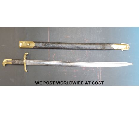 A brass hilted Lancaster 1855 pattern bayonet, 61cm blade, complete with leather bodied scabbard with brass mountings