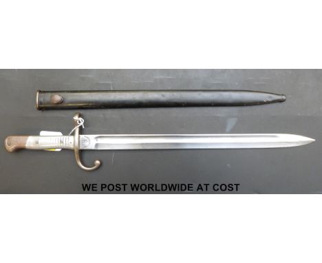 An Argentinan 1891 pattern Mauser rifle bayonet and metal scabbard, aluminium grips made by Weyersberg and Kirschbaum no. S20