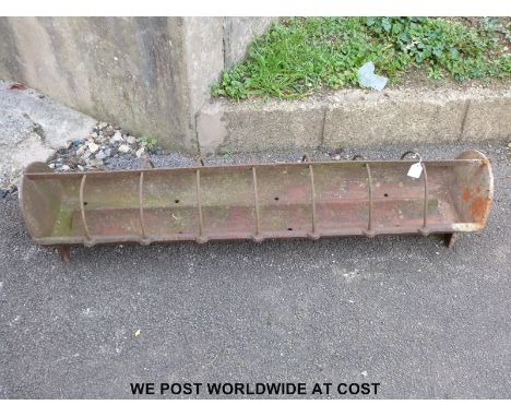 A small cast iron pig trough