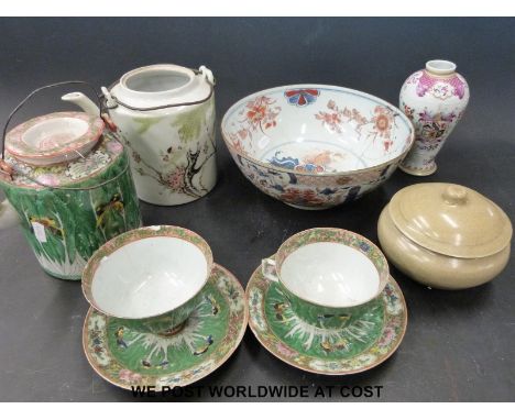 A collection of Chinese ceramics to include famille rose cups and saucers, teapots, celadon glaze pot, Chinese bowl, armorial