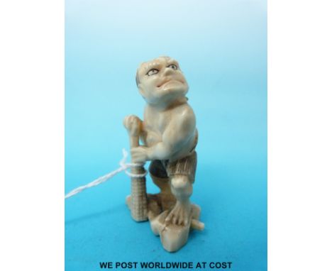 A Japanese Meiji period carved ivory okimono or netsuke of an ogre with a club (5.5cm tall)