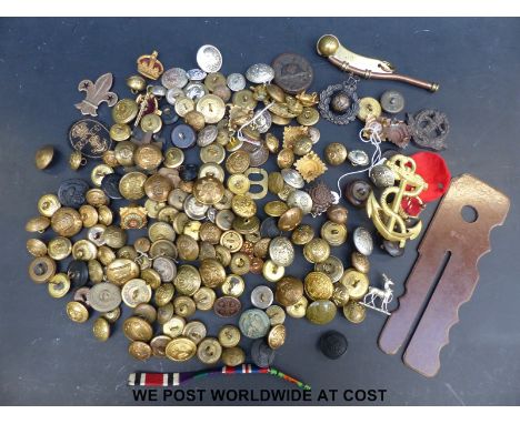 A box of miscellaneous military badges and buttons including Nazi German, British and a bosun's whistle and button stick. 