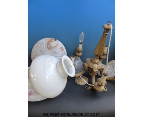 A quantity of glass light shades includes 1930's examples, chimneys etc
