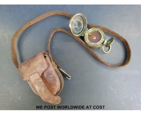 A Negretti and Zambra marching compass in leather pouch