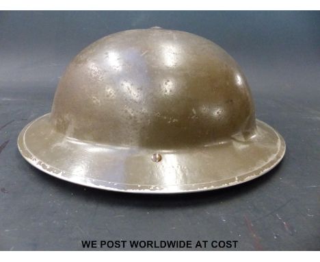 A 1939 WWII British Army helmet, named to inner rim 'G.D. Elliff'