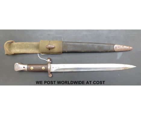 A Victorian 1888 pattern bayonet, stamped EFD and 53 with crown above to blade, in scabbard with canvas frog (overall length 