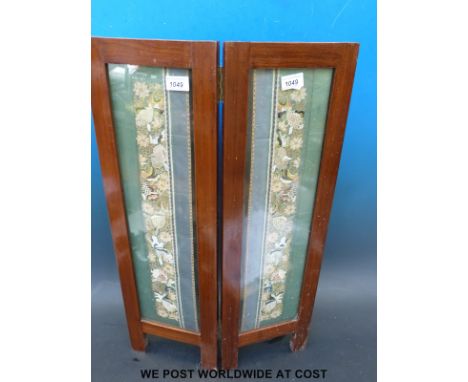 Two Chinese embroidered cuffs depicting fish and flowers, framed in a glazed fire screen (Each panel 23 x 73cm)