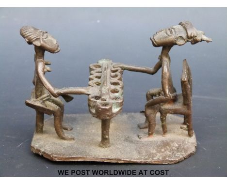 An Ashanti figure group, two figures playing a game (8cm tall) 