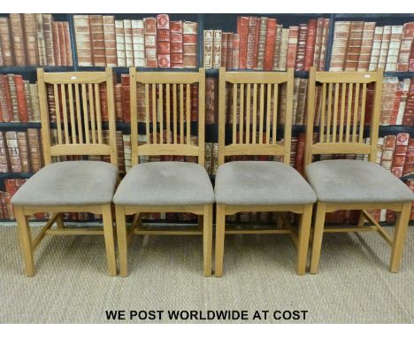 Four contemporary light oak dining chairs (L127cm x W32cm)