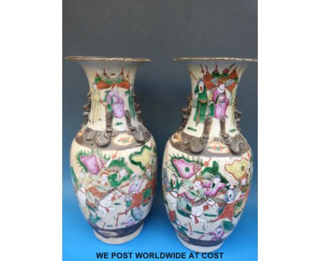 A pair of 19thC Chinese crackle glazed vases with enamelled figural decoration and seal marks to base (44cm tall)