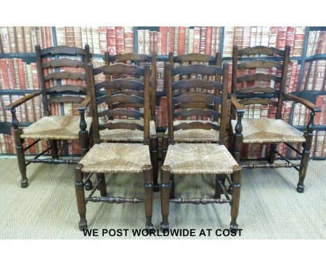A set of six (4+2) oak ladder back chairs with rush seats
