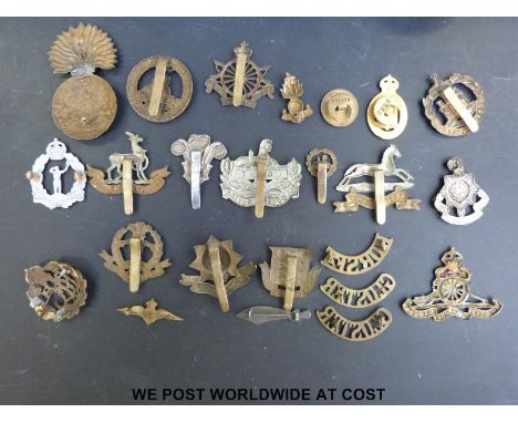 A collection of military badges, figural cigar cutter, candle and match holder, white metal dish etc., to include Army Cyclis