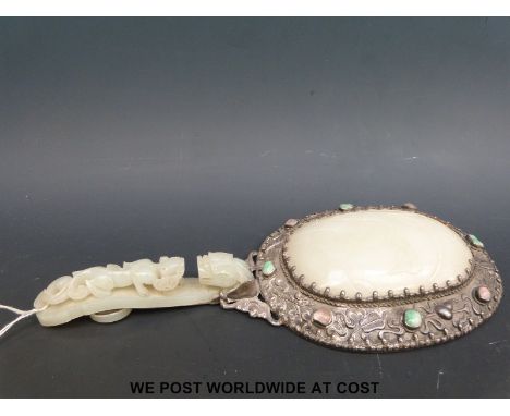 A 19thC Chinese mirror, the handle a celadon jade belt hook carved with dragon and lizard decoration, the mirror mounted in s