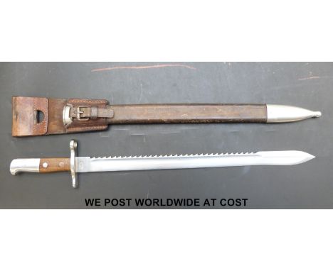 A 1914 pattern Swiss saw back engineer's bayonet by Waffenfabrik Neuhausen, stamped 14343 to hilt, complete with scabbard and