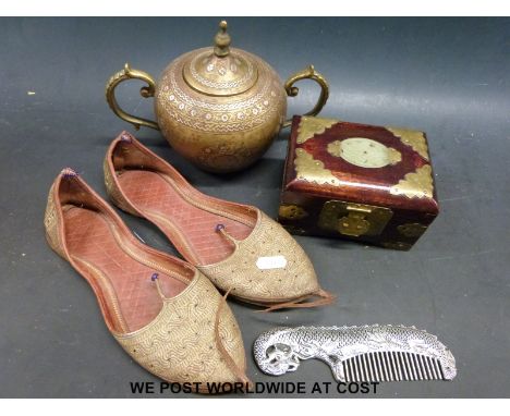 A pair of Eastern shoes together with a Chinese white metal comb, jade inset box and a brass inlaid urn