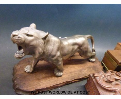 A silvered metal tiger, probably Japanese, carved boxes and copper and brass box/caddy 