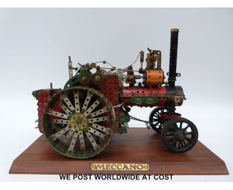 Meccano model of a traction engine with 20 volt electric motor on wooden plinth with Meccano plaque