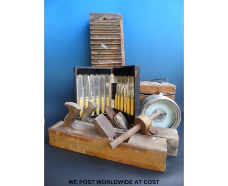A Toulet Imperator pigeon clock together with two vintage woodworking planes, an apple grinder and a case of plated cutlery